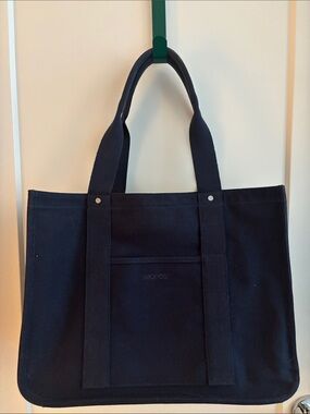 MONOS Gesso Tote Navy Canvas Tote Bag With Latch Closure and Luggage Strap